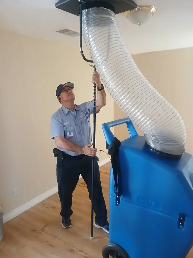 HVAC Installation technician using HEPA equipment in Humble